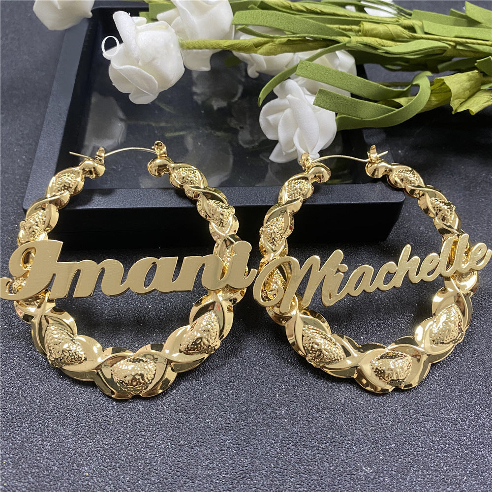 Pair of gold name hoop earrings