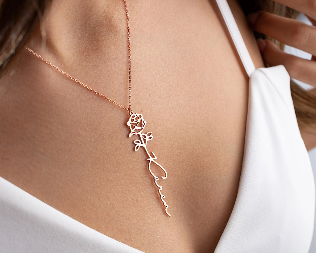 Model wearing rose gold birth flower name necklace