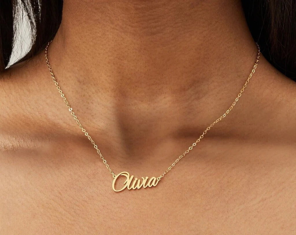 Gold 925 sterling silver script name necklace worn on neckline