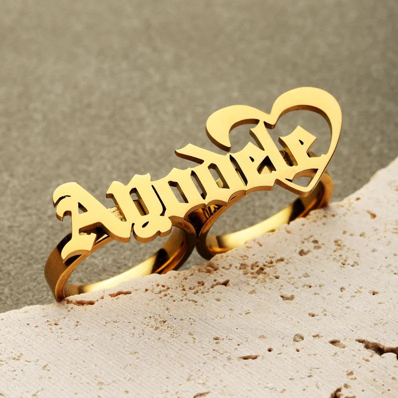 Gold script name ring close-up
