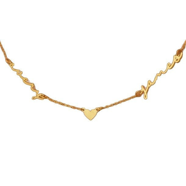 Gold two-name necklace with heart charm on white background