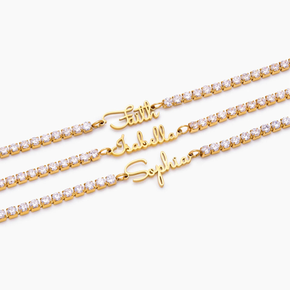 Gold custom name tennis bracelets on white background