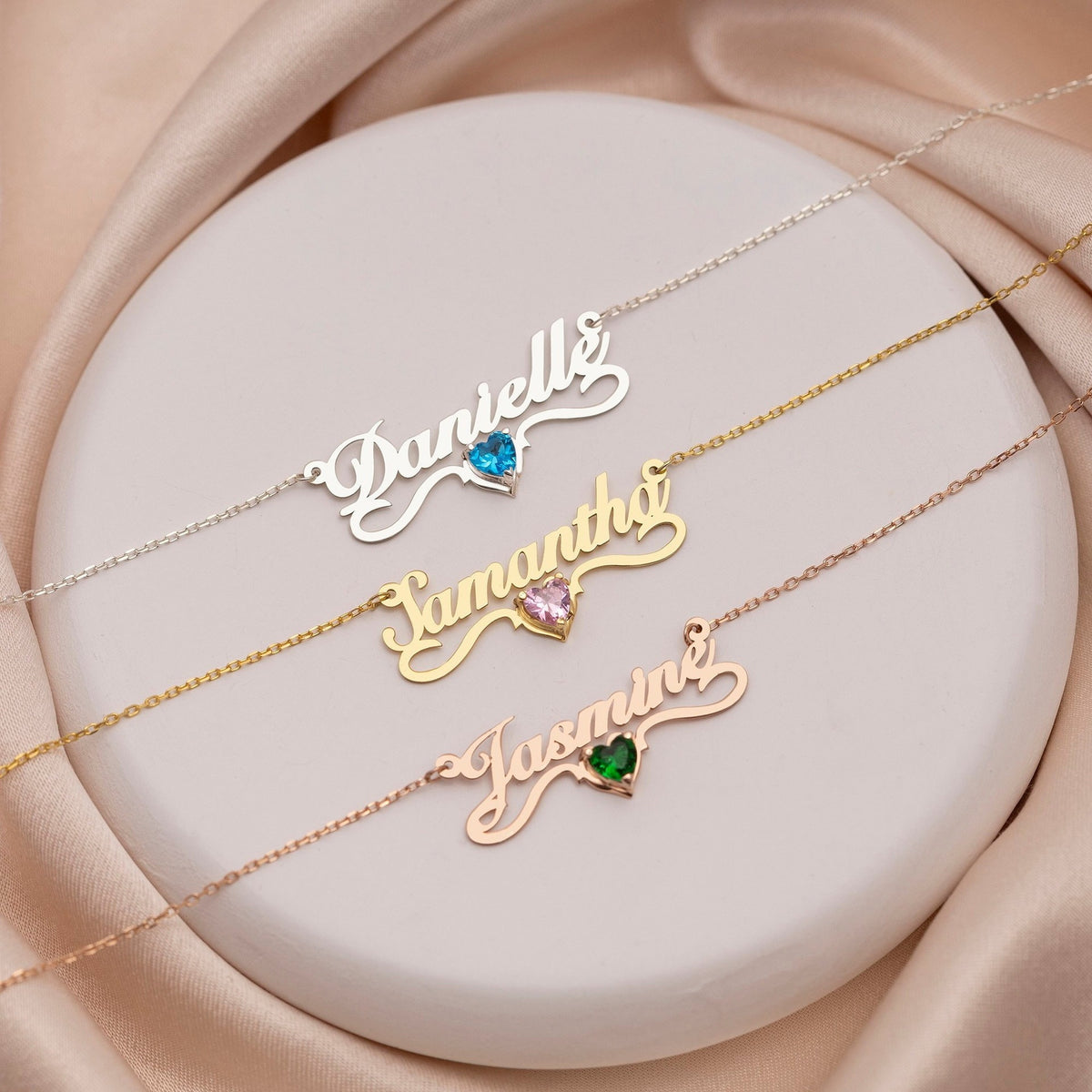 Three name necklaces with colored heart birthstones